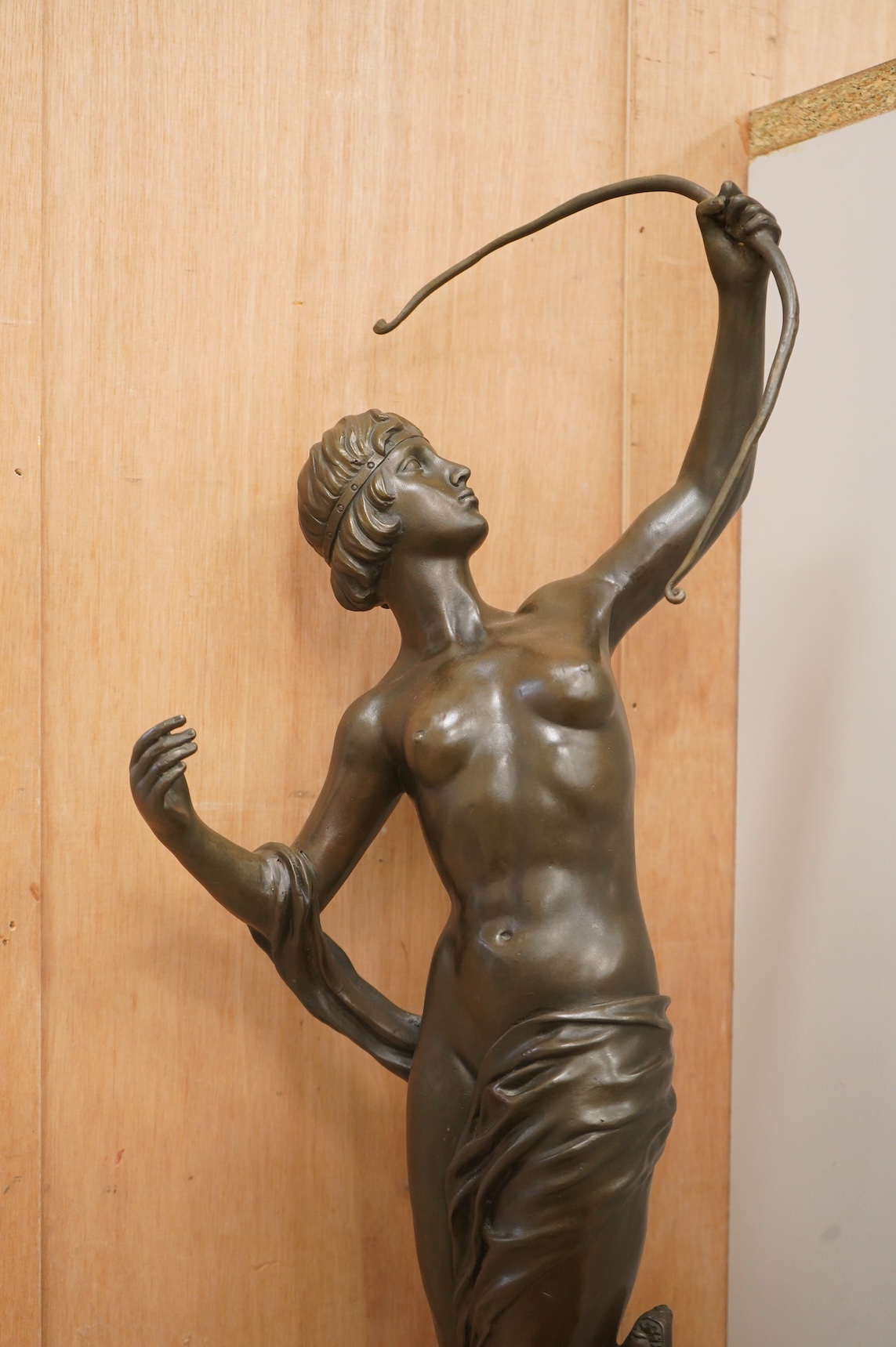 A large Art Deco style patinated bronze figure of Diana, unsigned on black marble base, height 85cm